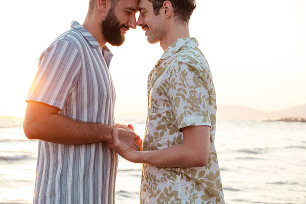 istock Affectionate couple sharing a heartfelt moment at sunset by the beach 2231453346