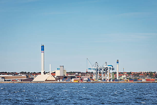 Helsingborg, Scania, Sweden - August 17th 2025:  One of the many manufacturing plants surrounding Helsingborg, a major industrial hub in southern Sweden, seen from the water. The coastal view highlights the city’s strategic location and its role as a key player in Scandinavian industry.