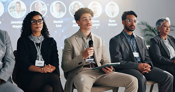 istock Conference, tablet and panel of people on a stage for discussion, seminar faq and presentation. Business summit, innovation expo and men with women with tech for tradeshow, event and convention 2231457635