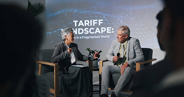 istock Interview, talking and people on a stage for seminar with FAQ, financial conference and tariff discussion. Presentation, business and woman with man for finance event, economic forum and convention 2231457649