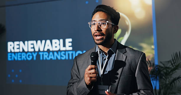 istock Man, speaker and mic with speech at conference for renewable energy transition at seminar. Person, public speaking and awareness for climate change, eco friendly solution and expo for hydrogen fuel 2231457673
