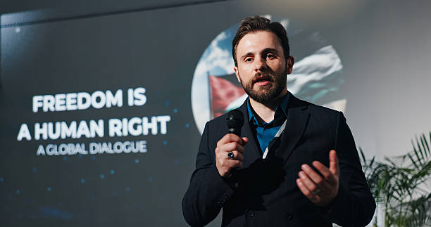 istock Man, presentation and human rights at convention on stage for talk, freedom or info at event. Person, public speaking and discussion at global conference for equality, accountability or peace in Gaza 2231457728