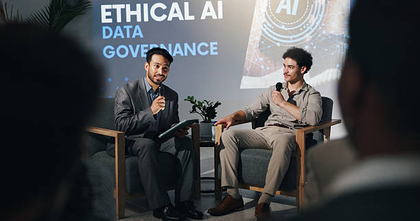 istock Business men, conference and panel discussion with host for AI governance, ethics or rules. Seminar, debate or talk with guest speaker on microphone for data compliance or policy guidelines on tablet 2231457742
