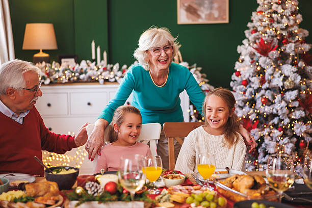 istock Grandparents surprising granddaughters with Christmas presents 2231458231