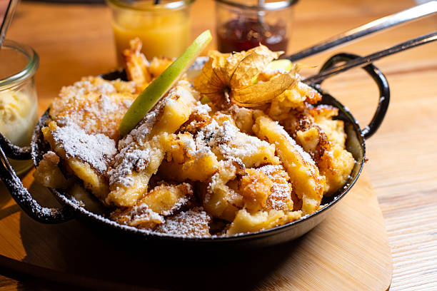 istock Austrian Kaiserschmarrn in a pan with apple sauce and plum jam 2231458588