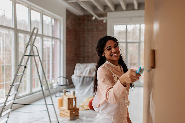 istock Young Woman Transforming Home Walls 2231458884