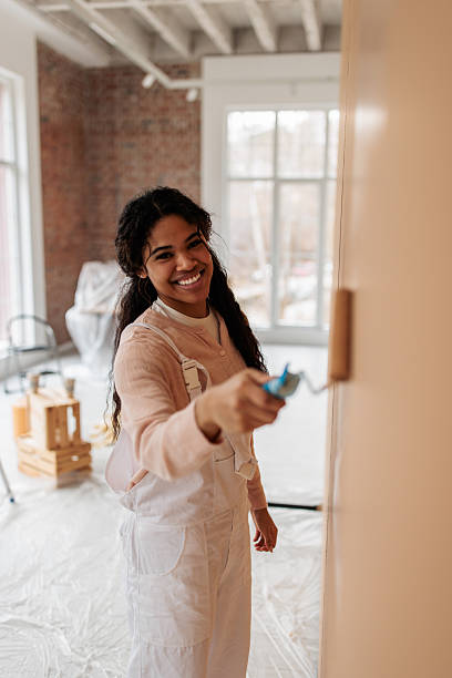 istock Creative Woman Transforming Home Walls 2231458901