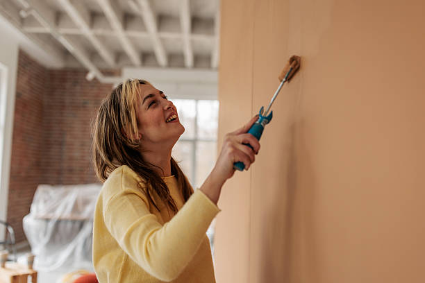 istock Creative Woman Transforming Home Walls 2231458915