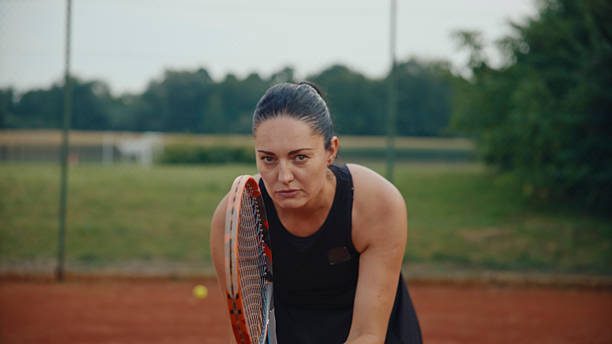 istock Caucasian Tennis Player Practicing on Clay Court 2231464029