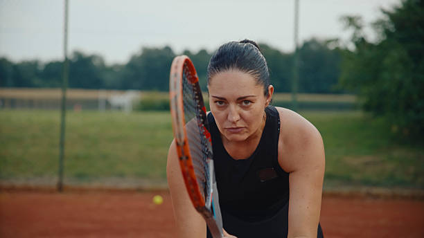 istock Caucasian Female Tennis Player Practicing on Clay Court 2231464032