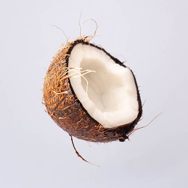 Cracked coconut on bright backround.Summer tropical concept