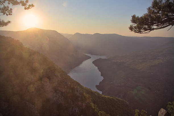 istock A breathtaking, panoramic view from a mountain peak as the sun sets 2231467379