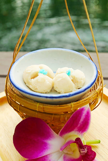 Closeup of Delectable Thai tiny biscuits called Kleeb Lamduan, meaning Lamduan flower's petals
