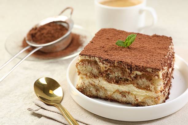 istock Delicious tiramisu with mint on light table, closeup 2231468276