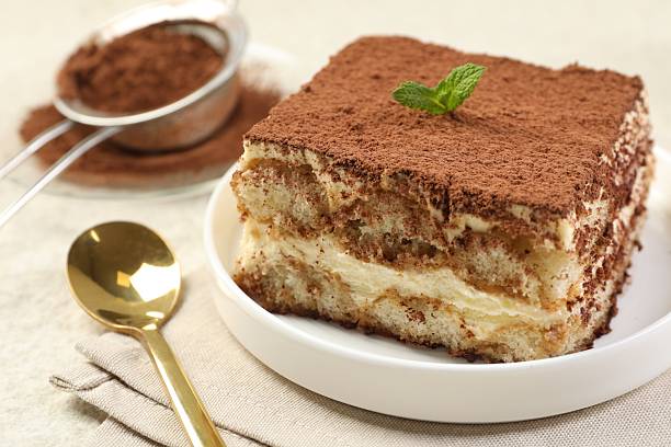 istock Delicious tiramisu with mint on light table, closeup 2231468295