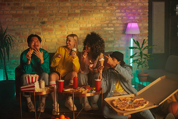 istock Happy friends eating indoors. 2231470434