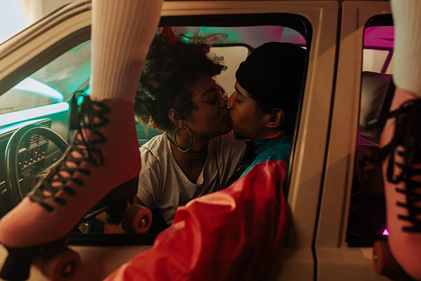 istock Romantic chic couple kissing in car. 2231470476