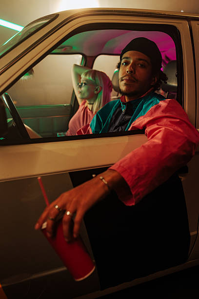 istock Stylish retro couple in car. 2231470496