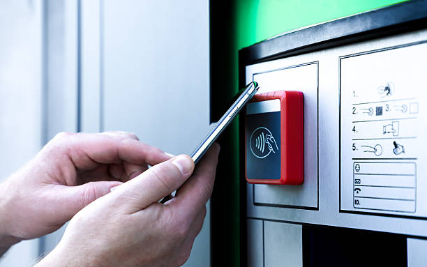 istock Contactless payment with a smartphone at a terminal, illustrating modern digital technology, mobile banking, and secure transactions. Ideal for fintech, innovation, and cashless lifestyle concepts. 2231471103