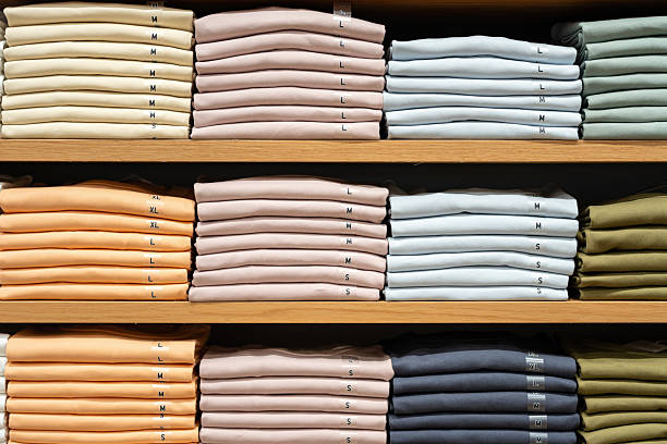 istock Cloths in various base color tone are folded on the shelf. 2231472114