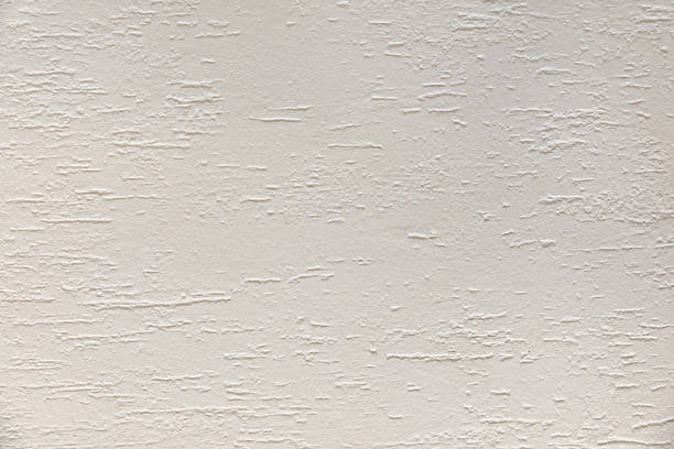 Background with macro detail of a wall painted with raw white plastic paint with a horizontal elongated drop effect.