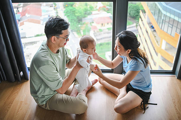 istock A Joyful Start: Parents and Baby Boy Share a Fun Morning Together 2231477446
