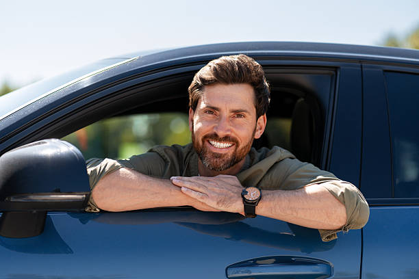 istock Happy driver smiling from car window 2231478291