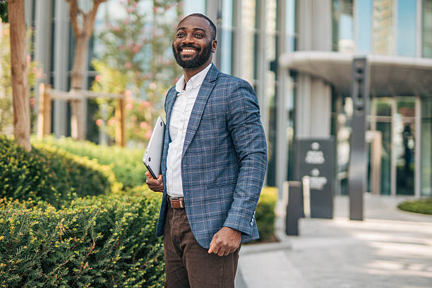 istock Confident businessman walking in urban setting 2231478833
