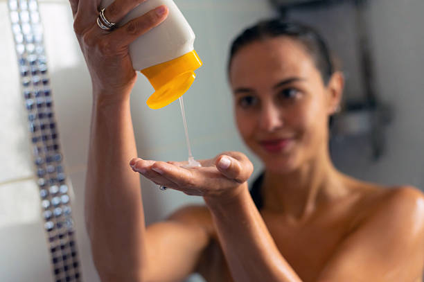 istock Happy young woman taking a shower 2231479129