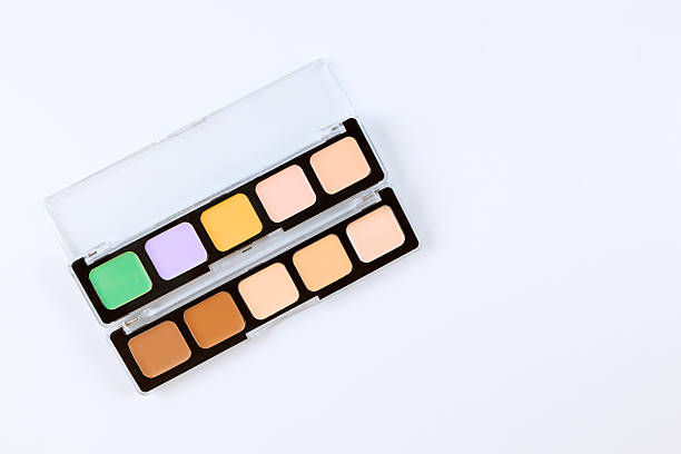 istock Colorful concealer palette arranged neatly on clean surface with various shades for makeup application beauty 2231480674