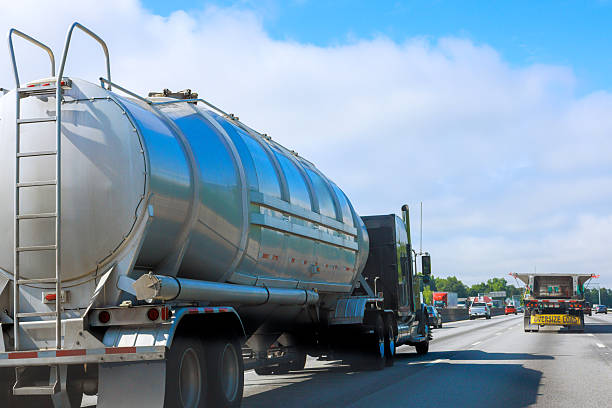 istock Heavy truck transporting liquid cargo on busy highway during sunny daytime hours 2231482555