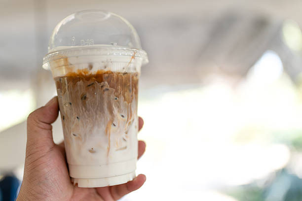 istock Iced latte coffee served in takeaway glass on hand 2231484009