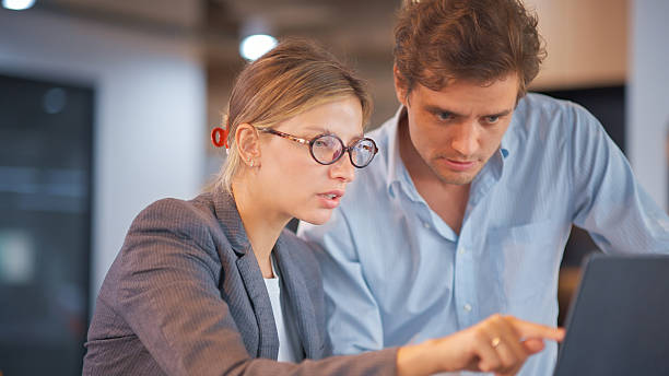 istock Business colleagues working together on data analysis project in a modern office. 2231487631