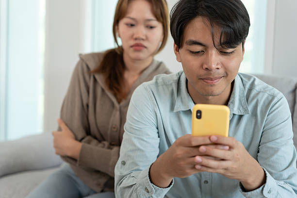 istock Double dating, husband use phone chat for somebody,, have a fling, Bit on the side , Commit adultery ,Polygamy, husband was having an affair. family problem, infidelity, divorce, separate 2231494459