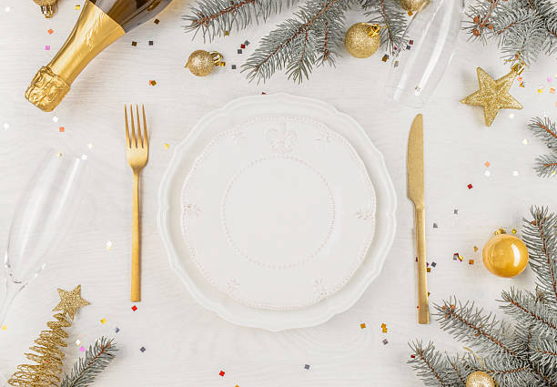 istock Elegant Christmas table setting with golden decorations and champagne. top view. copy space 2231495573