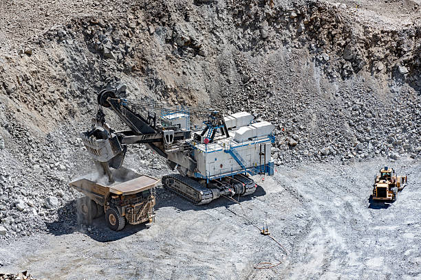 istock A large excavator loads a massive haul truck at an open-pit copper mine in Chile, showcasing the scale of the operation. 2231496224