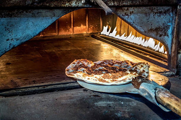 Freshly baked flatbread in traditional oven