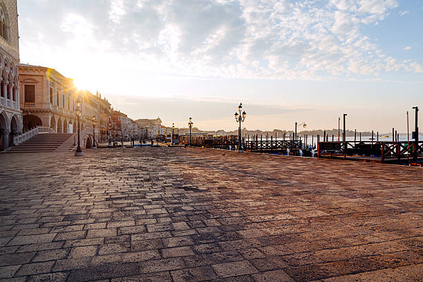 Venice, Italy - June 7th 2024: Parking lot for vacant gondolas in Canale Grande in the center of the the old town of Venezia