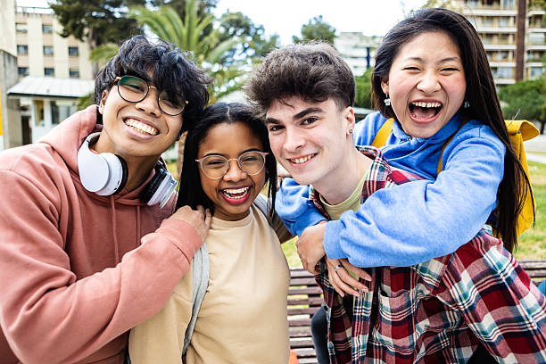 istock Cheerful multiracial young students friends standing at campus college 2231505485