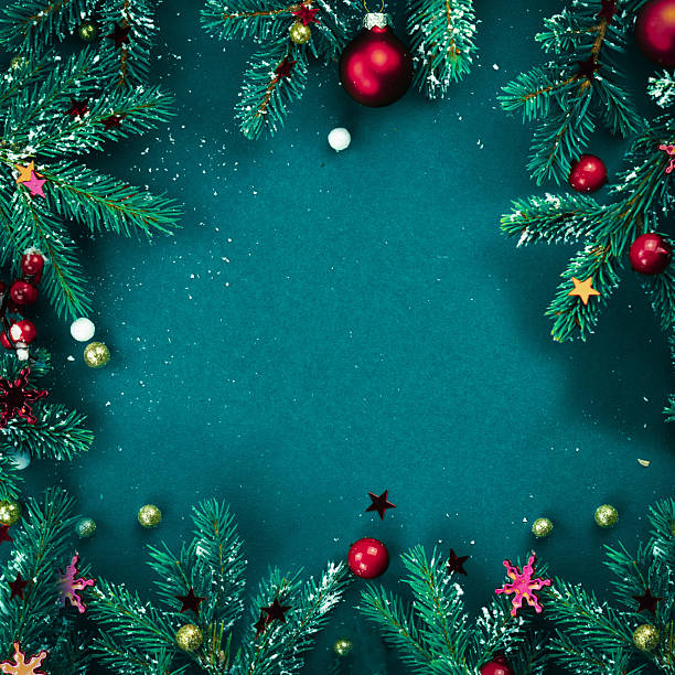 An original frame in dark green with space for text for creative work on a winter theme.