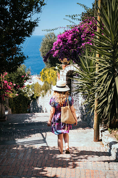 istock Woman walking down stairway in Capri 2231510115
