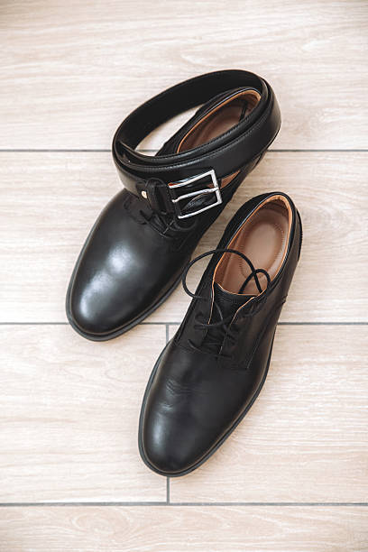 istock Black leather shoes and belt 2231510162
