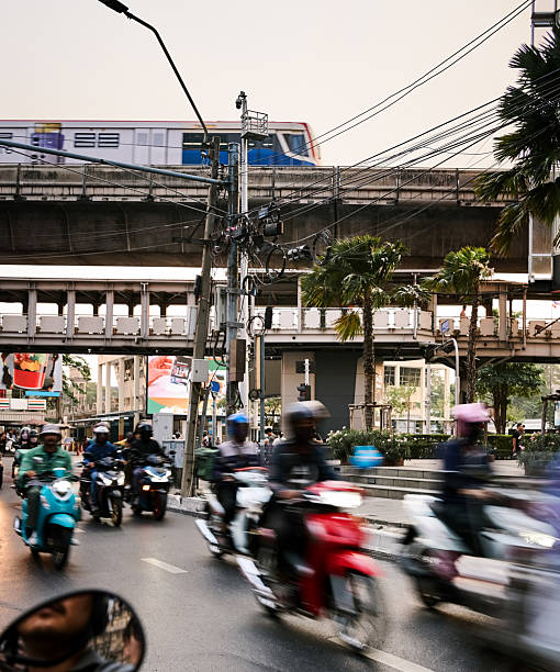 istock Motorbikes speeding under Bangkok train tracks 2231510820