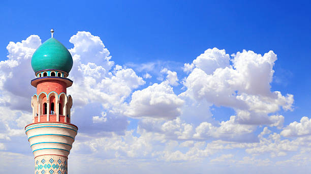 istock Horizontal banner with minaret of Friday Mosque against a blue sky backdrop with white clouds, Ardabil, Iran. Topic of vacation, travel, trip abroad on vacation, cruises and tours. Copy space for text 2231511709
