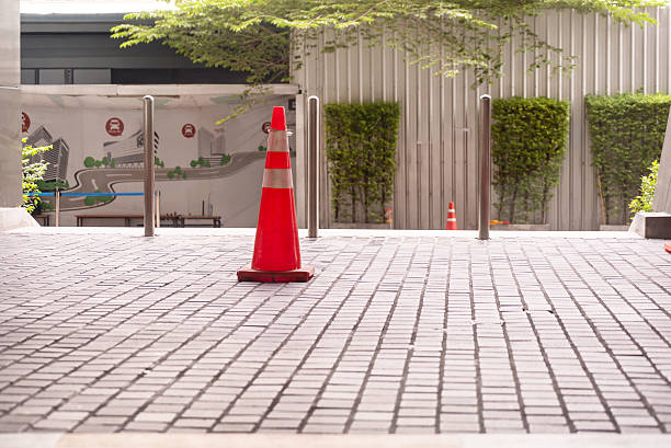 istock Bright Safety Cone in Urban Environment 2231518157