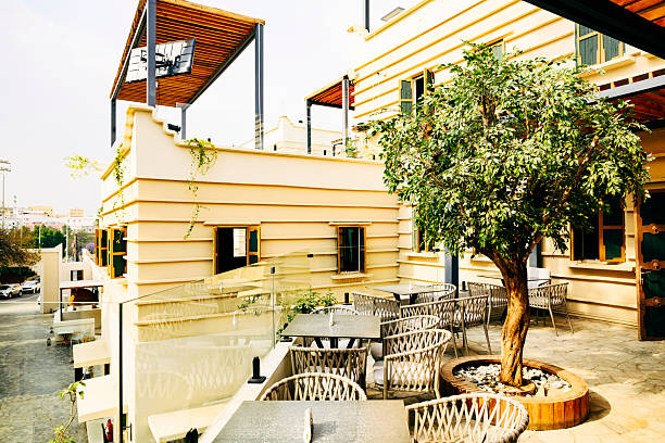 Terrace with tables and chairs outside building, Asir, Al Muftaha village, Aseer Province