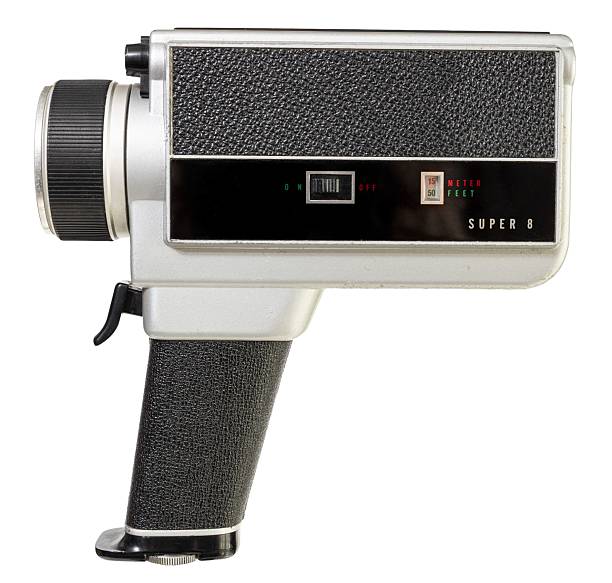 Vintage super 8 film camera isolated on white background. Side view