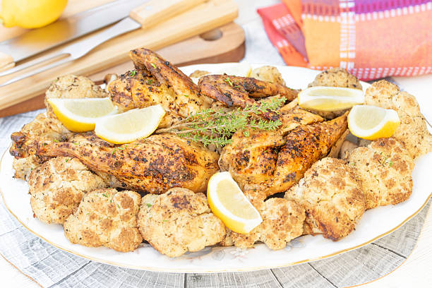 istock Baked chicken and cauliflower with lemon 2231532244