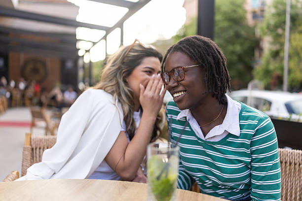 istock Two Friends Enjoying Friendly Conversations at an Outdoor Cafe 2231535970