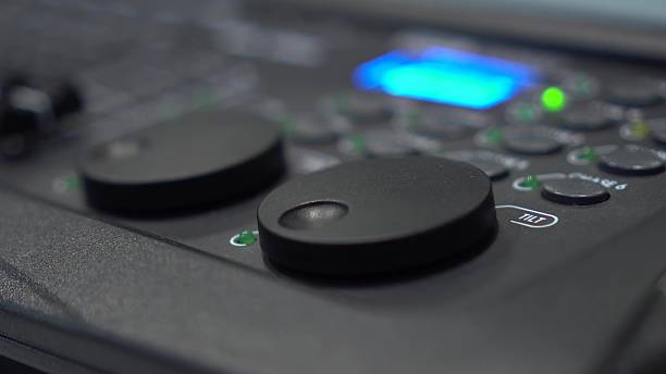 istock Close-up of finger adjusting Tilt shuttle on lighting console 2231536034